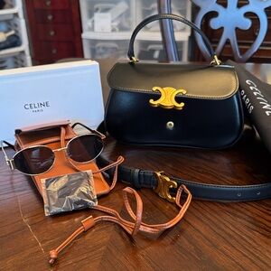 No brand small bag with belts and sunglasses. 
NO BRAND.